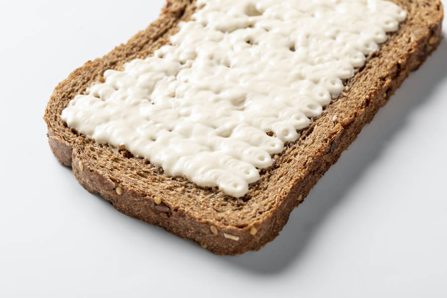 Slice of bread surface covered with sauce by a FoodJet food depositor