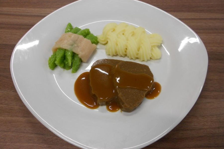 White plate with 3D printed roast potato greenbeans by a FoodJet depositing system