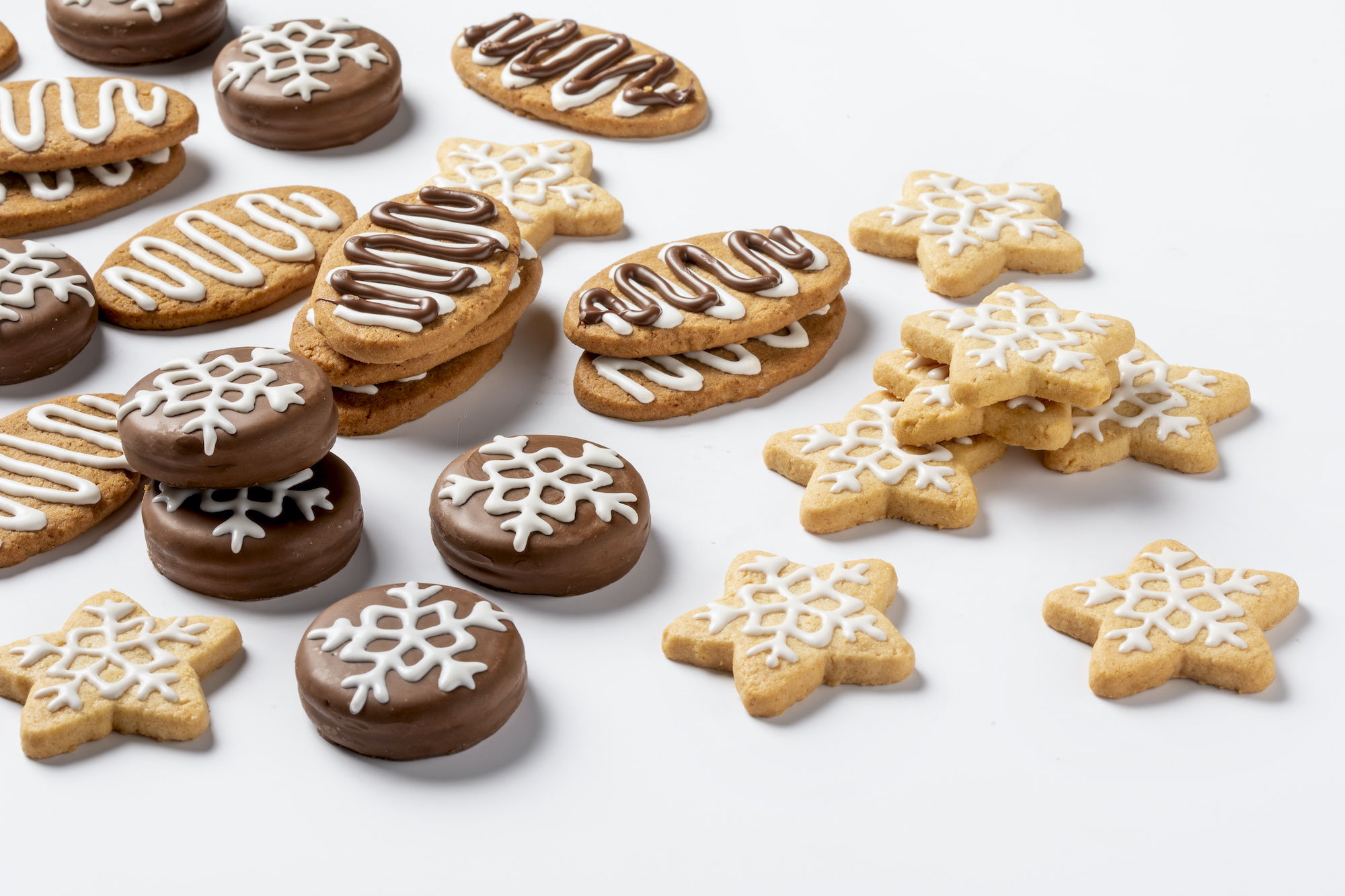 Various shaped biscuits decorated with chocolate by FoodJet chocolate depositing system