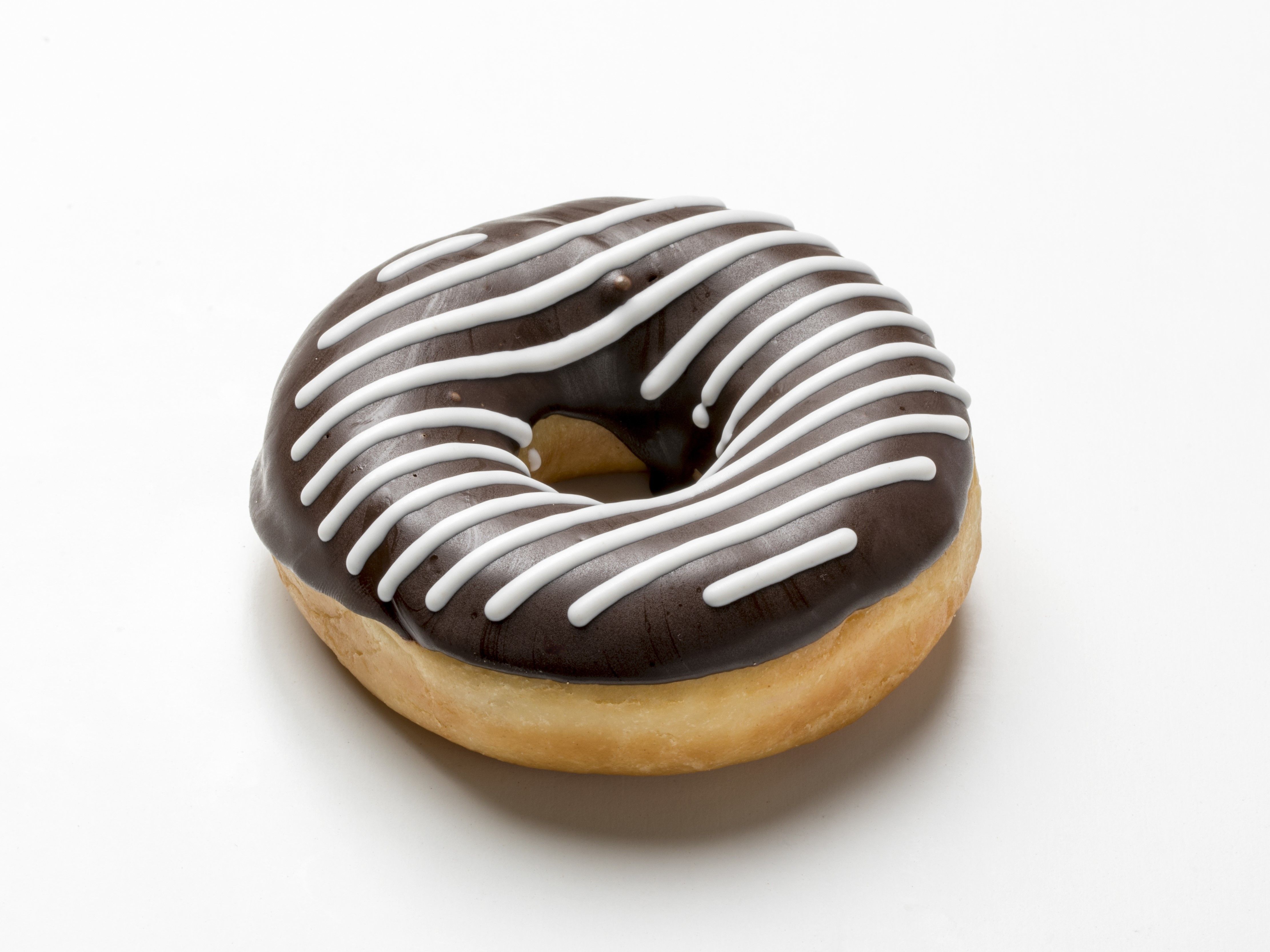 Donut decorated with dark and white chocolate in a pattern