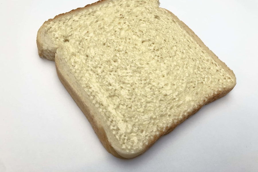 Slice of bread with butter applied