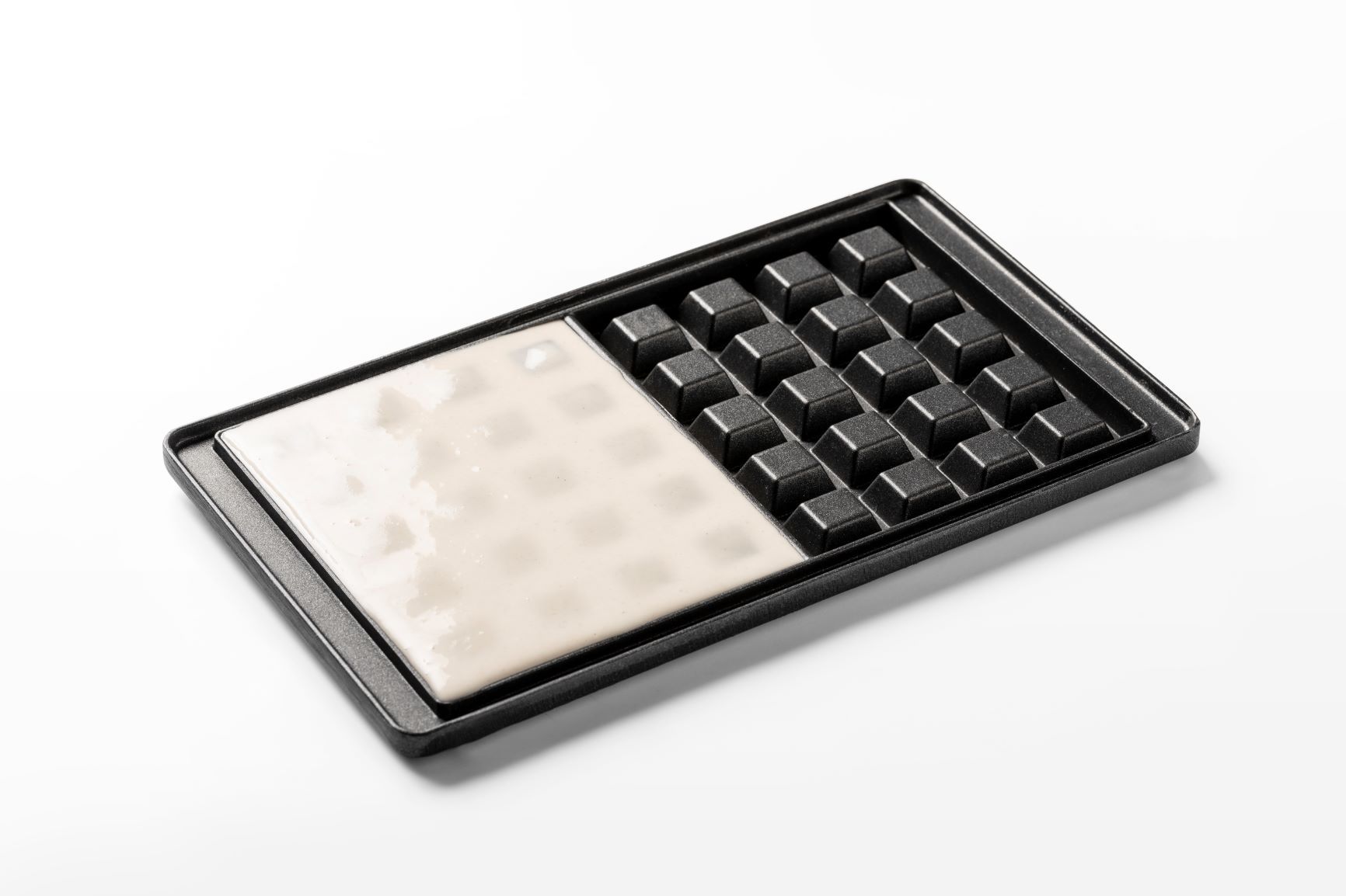 Waffle mould with batter accurately applied by FoodJet batter depositor