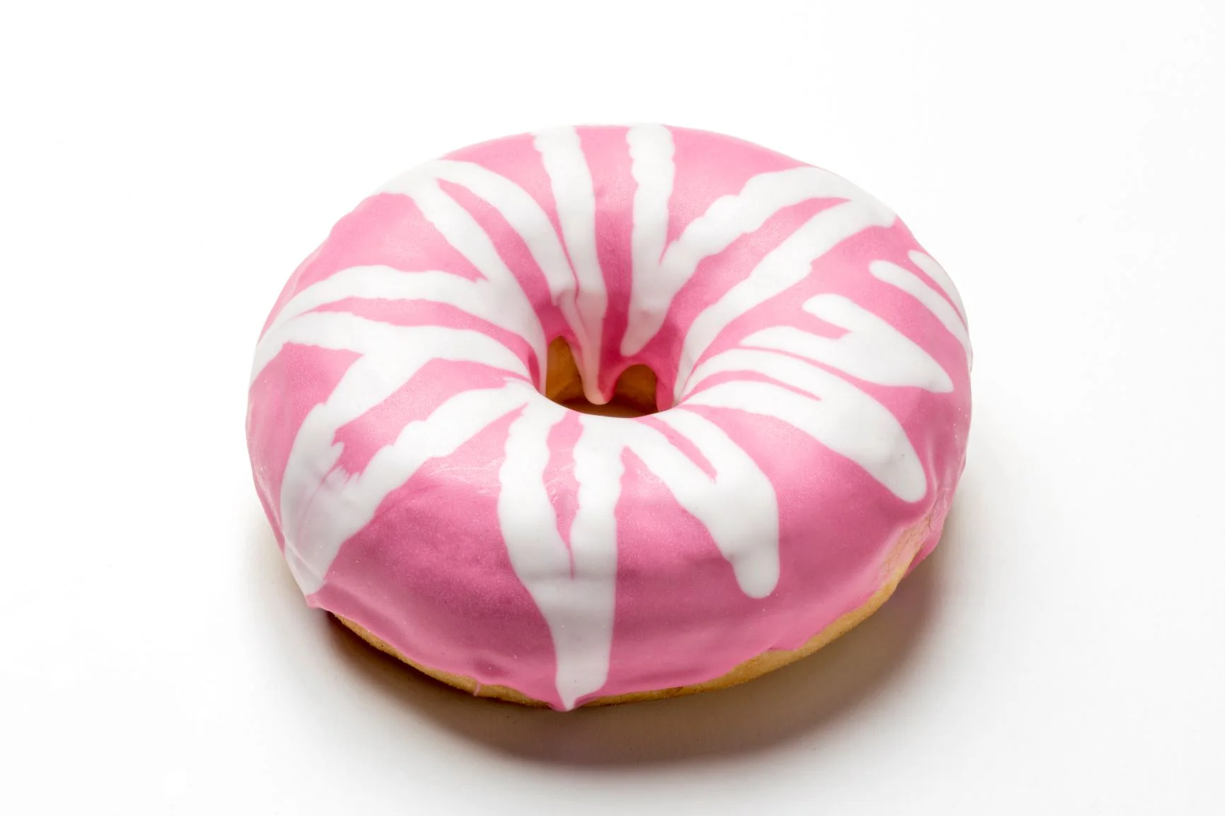 Pink donut with cool white chocolate decoration made with a FoodJet chocolate depositor