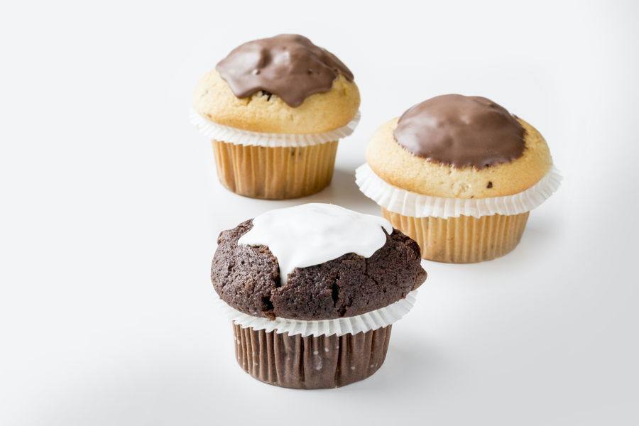 3 muffins surface  covered with white and milk chocolate by a FoodJet food depositor