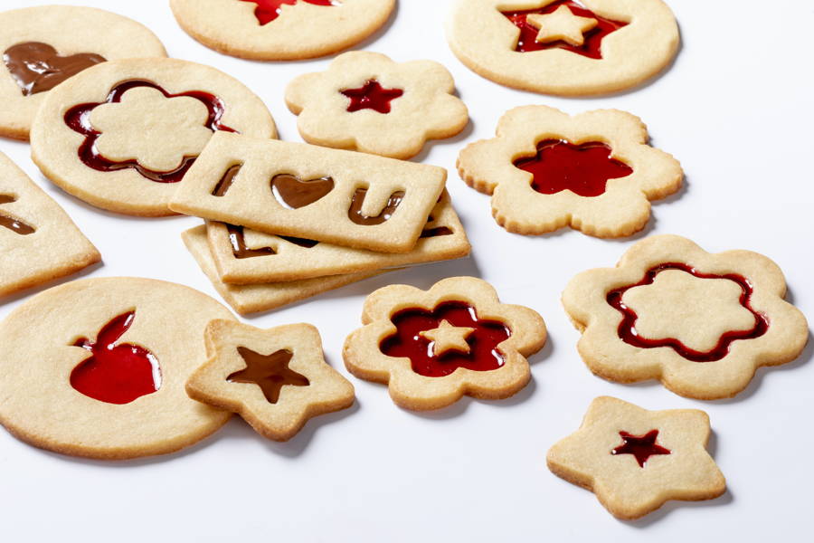 Various biscuits cavity filled with marmalade by a FoodJet precision depositing system