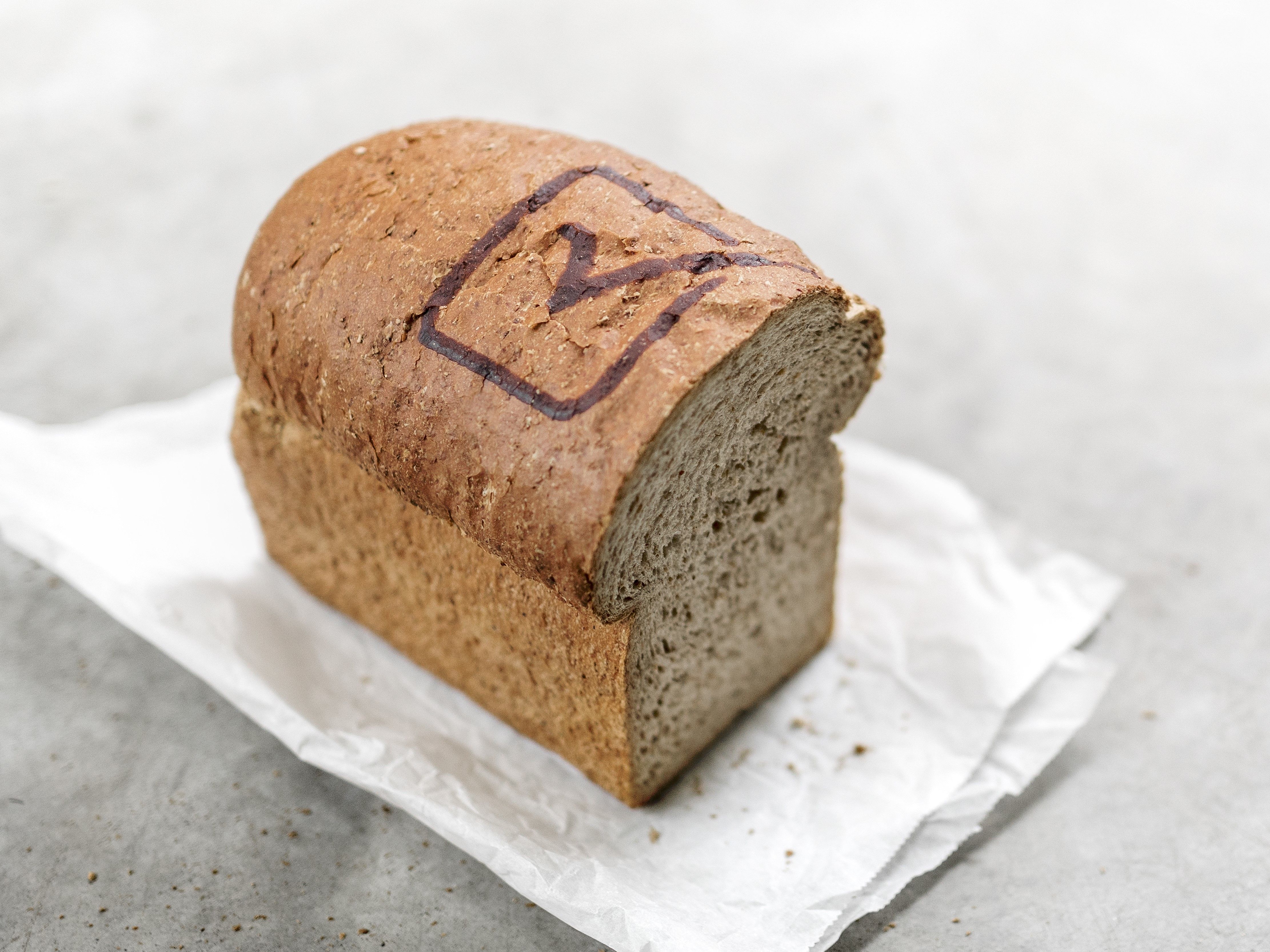 Bread decorated with RudinJet paste in the form of a checkmark