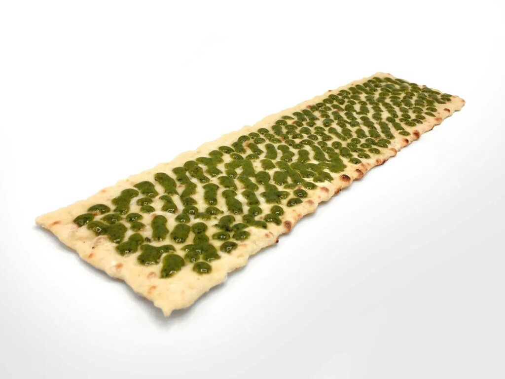 Pesto sauce on flatbread