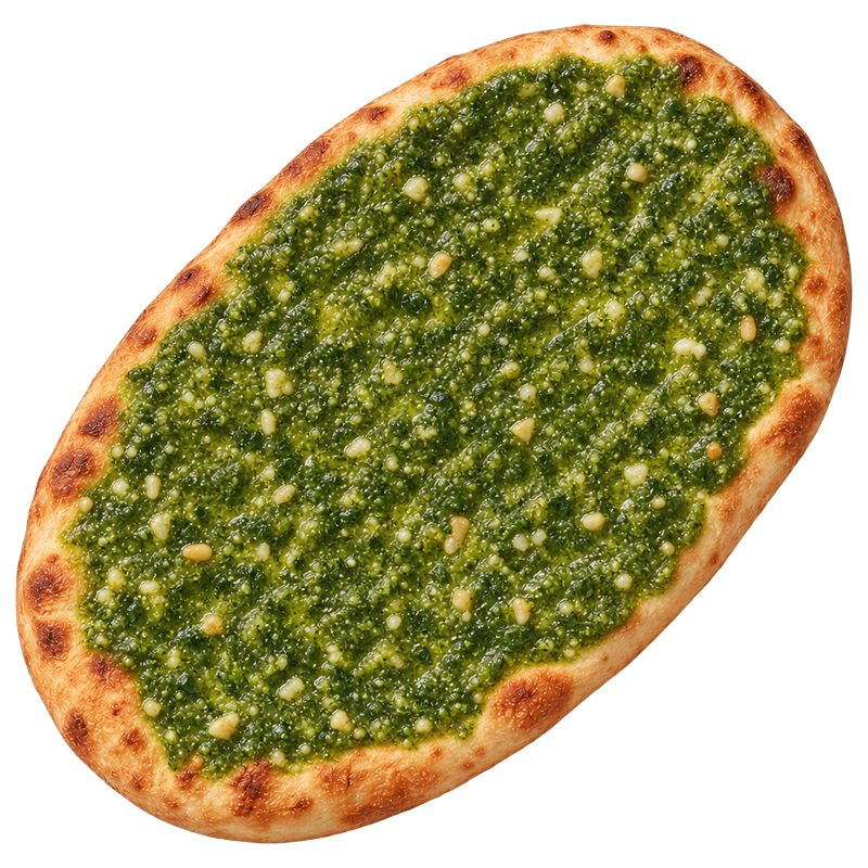 Oval flatbread with an even layer of green pesto